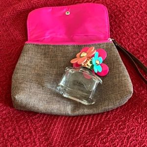 50ml. Marc Jacobs Daisy with a cute little clutch/bag.Used a couple of times